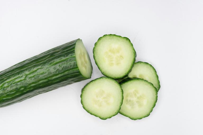 Fresh green cucumber with smooth skin and natural texture. Cucumbers can be grown in the community garden
